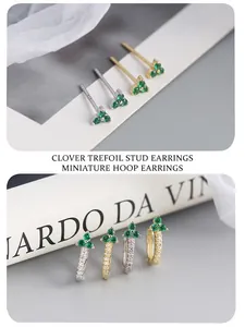 Detail of 925 sterling silver earrings with emerald green flowers and diamond accents