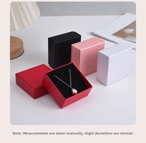 Macro shot of diamond-textured jewelry gift boxes with plush inserts in four elegant colors