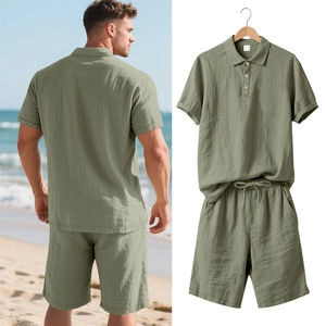Detail of sage green men's linen polo set showing breathable texture and drawstring waist