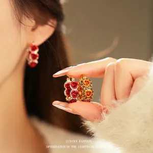 Exquisite gold-plated flower hoop earrings with red resin roses and sparkling diamonds