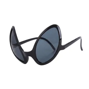 Close-up of funny alien party glasses with thick black plastic frame and grey lenses