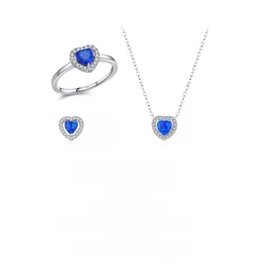 Detailed set of 925 sterling silver jewelry with blue heart opal stones and small diamonds