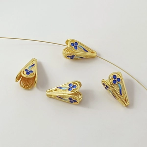 Macro detail of 18K gold-plated cloisonne flower bead caps for DIY jewelry making