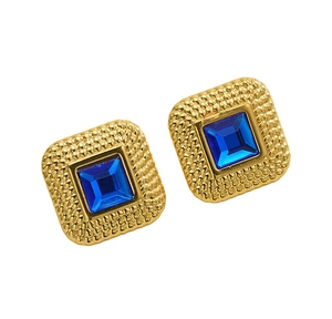 Detailed view of vintage square gold earrings with blue gemstone and textured borders