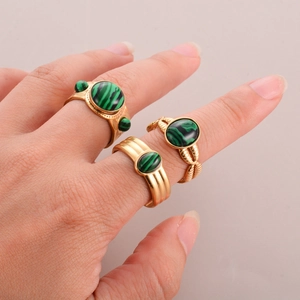 Vintage gold-plated titanium steel rings featuring green malachite stones in three retro styles
