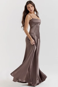 Detail of silk satin dark cocoa evening dress showing smooth fabric texture and drape