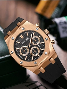 Macro shot of gold octagonal sports watch with three sub-dials and black rubber strap