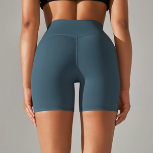 Close-up of high-waist yoga shorts with V-shaped back seam and soft gray-blue fabric