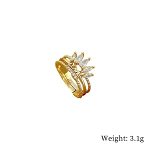 Detail of gold crown ring featuring pavé zircons and engraved LOVE text on the band
