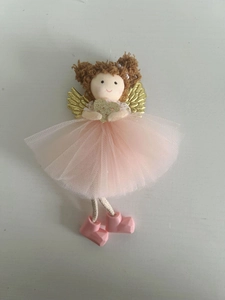 Detailed view of pink mesh skirt and golden wings on a Christmas angel ornament