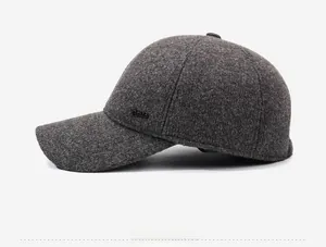 Detailed side view of dark grey wool blend baseball cap with metallic accent mark