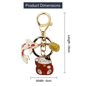 Japanese Maneki Neko and Koi Fish keychain in gold metal with colorful enamel charms