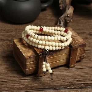 108 sandalwood beads wrap bracelet in cream white with red accents on vintage wooden box