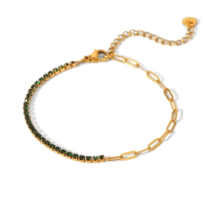 Close-up of gold paperclip chain bracelet with inlaid green cubic zirconia and lobster clasp