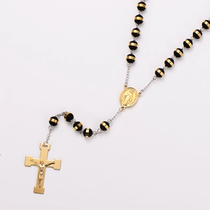 Detail of 8mm striped prayer beads with a golden religious pendant and cross