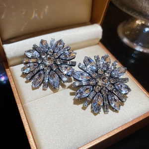 Luxurious flower stud earrings with sparkling crystals and silver-tone metal finish