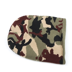 Detailed view of winter beanie featuring a jungle camouflage knit pattern with textured ribs