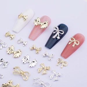 3D metallic bow tie nail art charms in gold and silver finish for DIY manicure decor