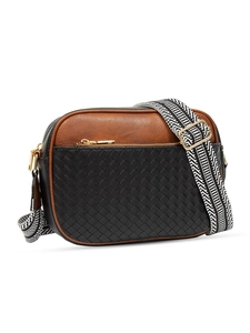 Detail of quilted woven crossbody camera bag with black and brown panels and striped strap