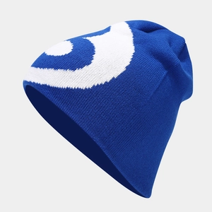 Royal blue knitted beanie with white abstract swirl pattern for winter outdoor warmth