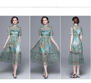 Detailed views of dark green mesh maxi dress showing embroidered high neck and pleated hem