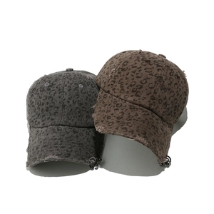 Distressed leopard print baseball caps with metal rings and streetwear ripped details