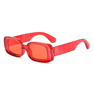 Retro small square red sunglasses with unique layered textured temples on white background