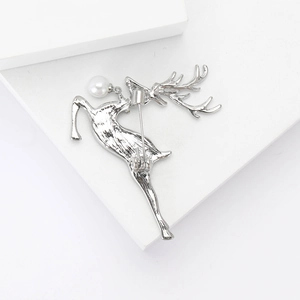 Silver alloy elk brooch with pearl accent showing the secure pin back mechanism