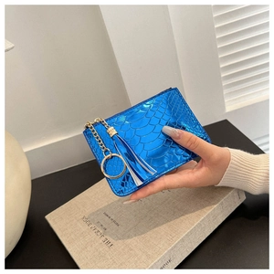 Detail of blue crocodile pattern short wallet with metal chain and tassel keychain