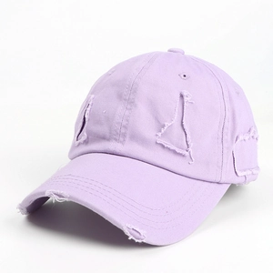 Detailed view of the distressed lavender cotton baseball cap with ripped brim edges