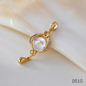 Close-up of gold moonstone pendant with iridescent stone and teardrop detail