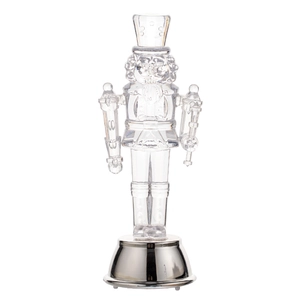 Modern transparent acrylic nutcracker soldier ornament with a polished silver metal base