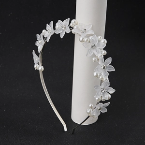Elegant white floral headband with pearls and rhinestones on silver metal frame