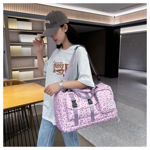 Large pink leopard print gym bag with adjustable shoulder strap and double handles