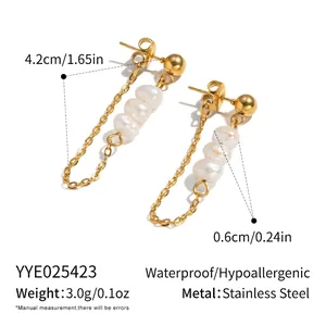 Detail view of gold stainless steel pearl tassel earrings with precise size dimensions