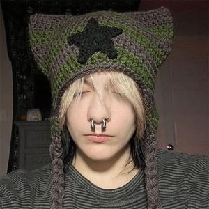 Detail shot of the star knit cat ear beanie featuring dark green and grey stripes