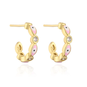 Macro detail of 18K gold-plated C-shaped earrings with pink enamel evil eye and zircon stones