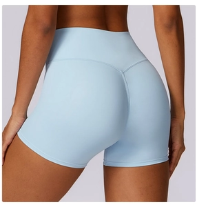 Detail view of high-waist yoga shorts featuring V-shape peach butt stitching in light blue