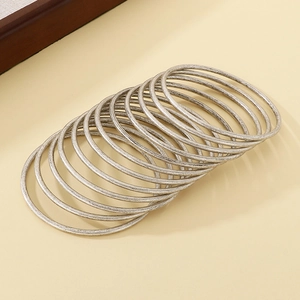 Detail of 12-piece set of 3mm vintage silver stainless steel stackable bangles