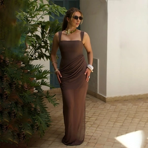 Detailed view of brown maxi dress featuring elegant waist ruching and lightweight fabric