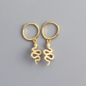 Macro detail of irregular gold-plated S925 silver snake-shaped drop earrings