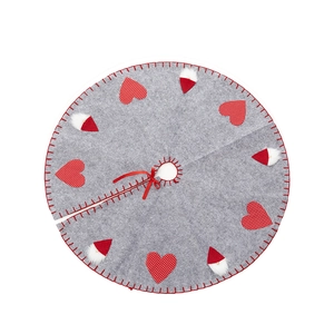 Gray felt Christmas tree skirt with red polka dot hearts and Santa hat patterns