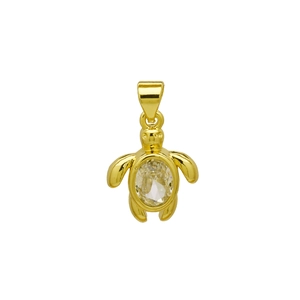 Detail shot of a gold sea turtle pendant with a faceted oval gemstone on white background