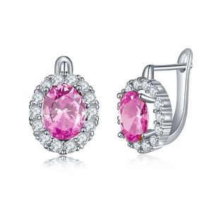 Close-up of pink oval zircon earrings with a halo design and silver lever-back hooks