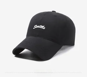 Side view of black baseball cap featuring white 3D Seattle embroidery on cotton fabric