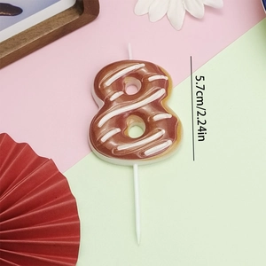 Close-up of chocolate-colored number 8 donut candle with frosting, 5.7cm height detail