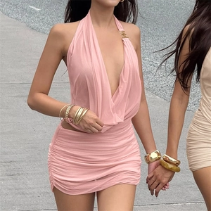 Detailed view of a pink halter neck deep V-neck mesh top and ruched bodycon mini skirt set