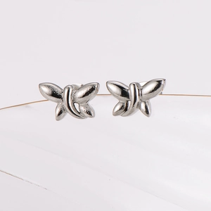 Minimalist silver dragonfly stud earrings made of polished stainless steel for women