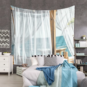Detail of bohemian wall tapestry featuring a realistic ocean view and white curtains