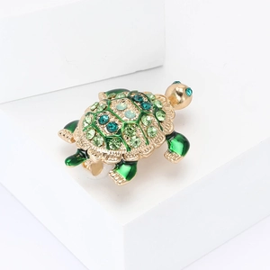 Exquisite gold-plated turtle brooch with sparkling green rhinestones and enamel details